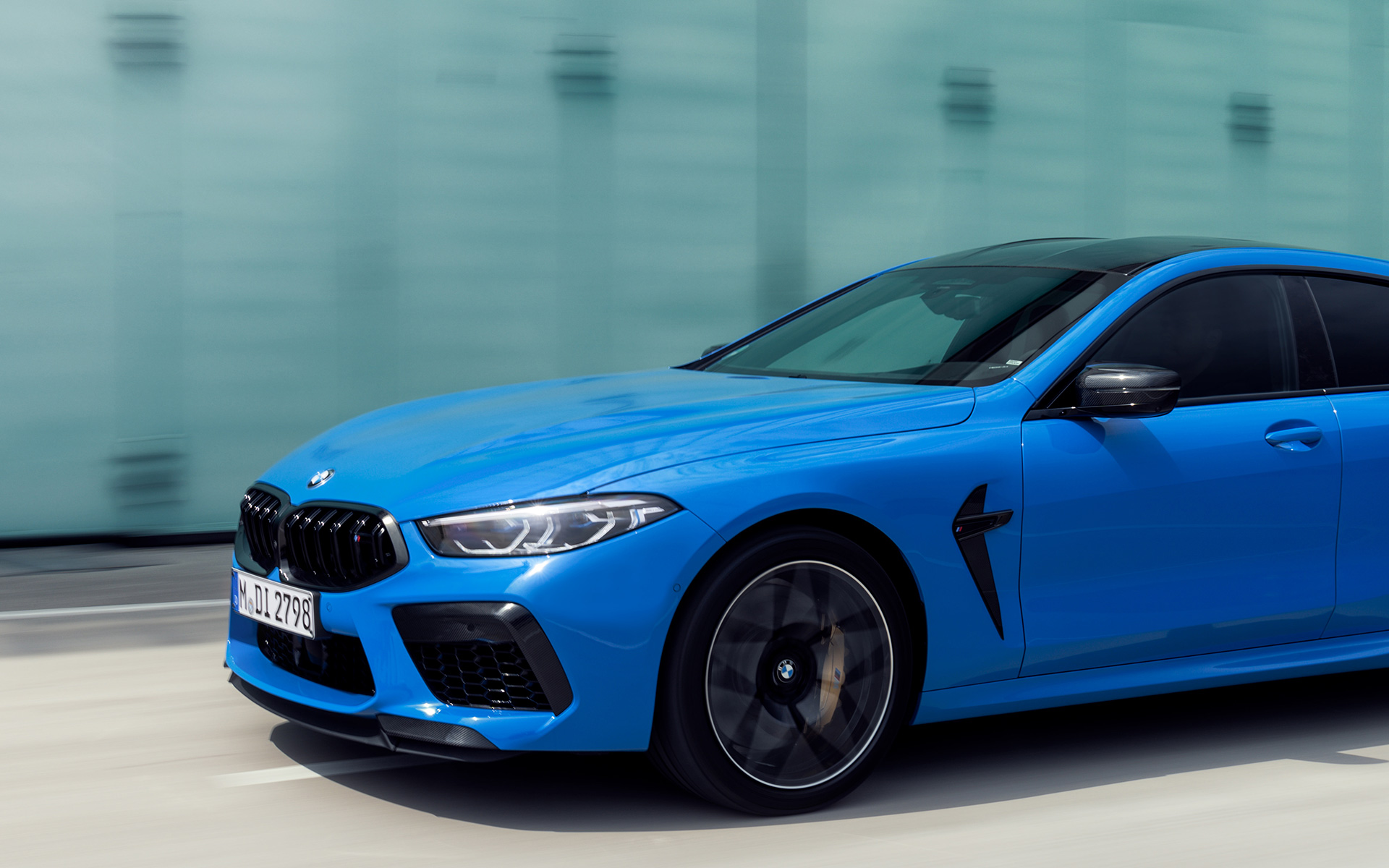 BMW M8 Competition Coupé F92 2019 BMW Individual Voodoo Blue three-quarter side view in section driving